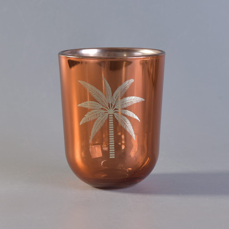 Gold electroplated glass candle jar with coconut tree pattern Gold electroplated glass candle jar with coconut tree pattern