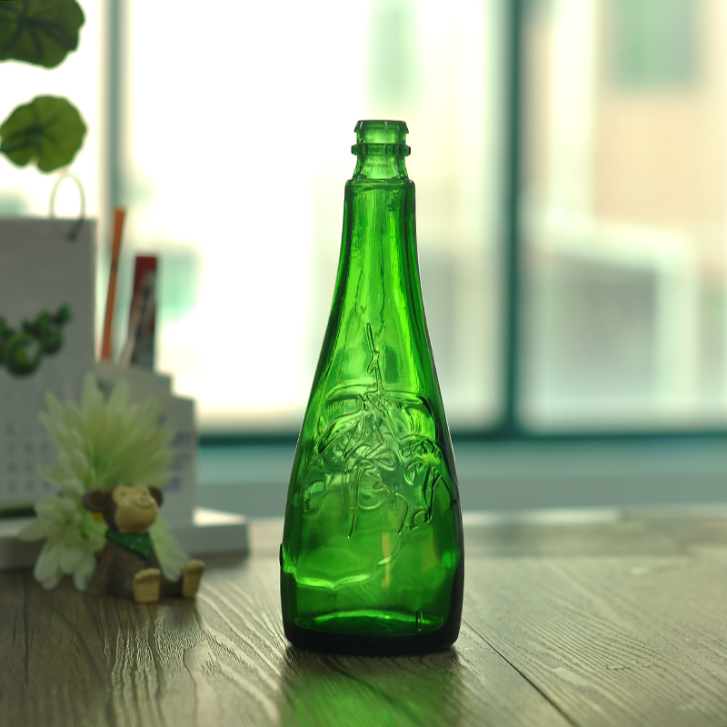 Green flat bottom glass liquor bottle
