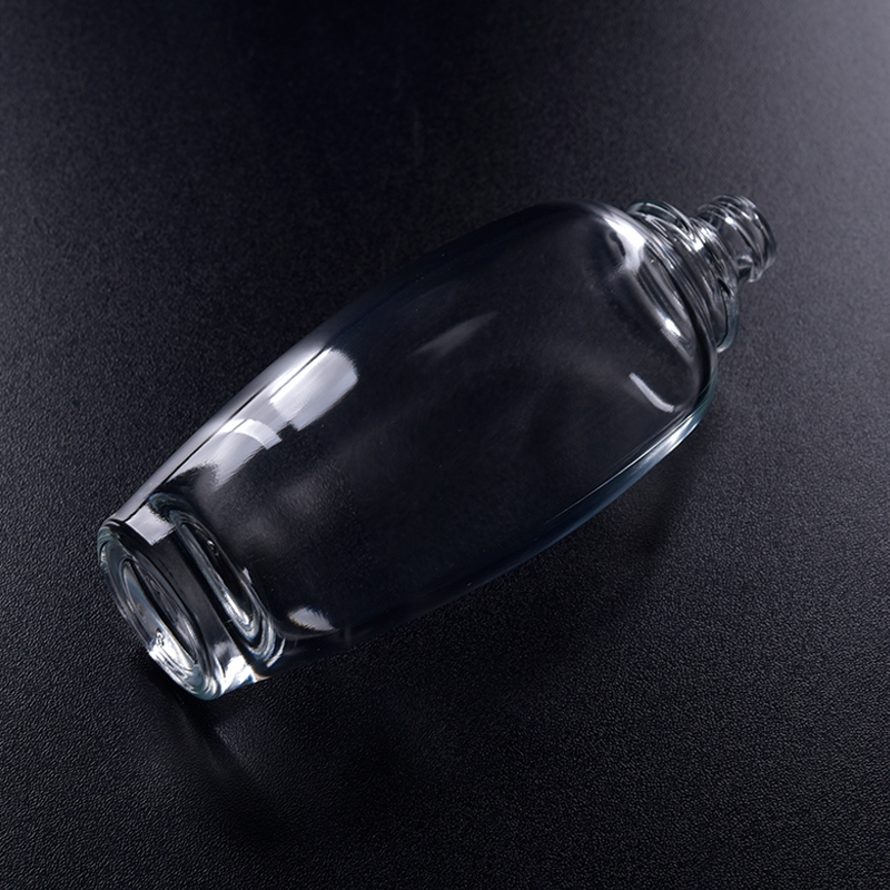 Oval transparent glass perfume bottle