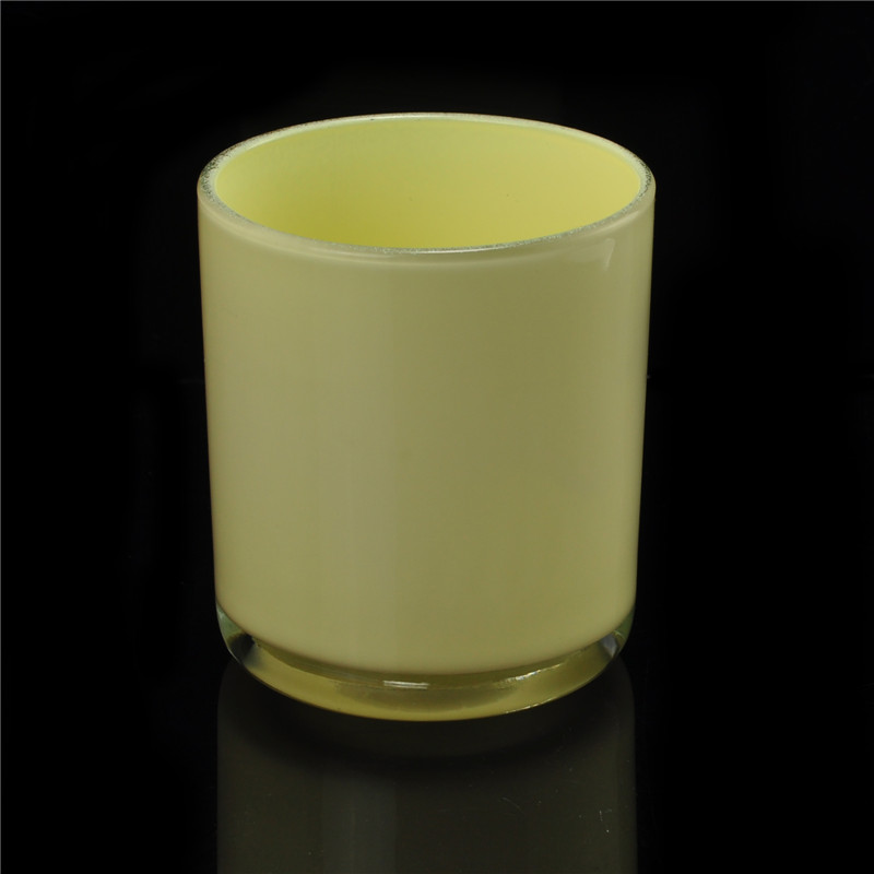 Yellow painted cylindrical glass vessel for candles Yellow painted cylindrical glass vessel for candles