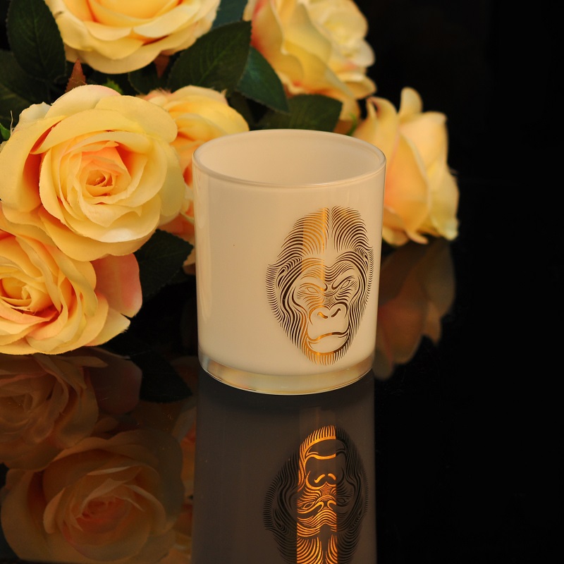 white glass candle holder with animal pattern gold decor