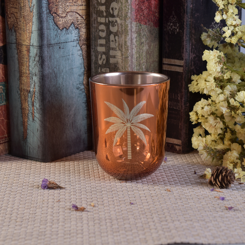 Gold electroplated glass candle jar with coconut tree pattern Gold electroplated glass candle jar with coconut tree pattern