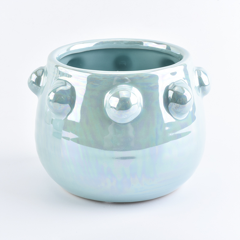 Blue ceramic candle jar with iridescent effect glaze finish
Blue ceramic candle jar with iridescent effect glaze finish