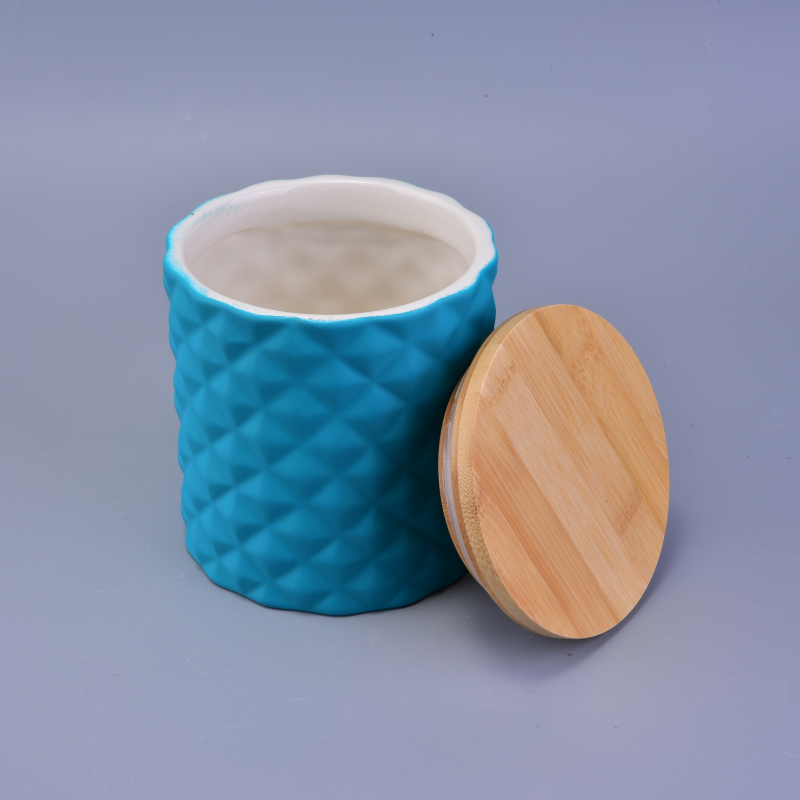 blue ceramic candle holder with diamond-shaped pattern surface