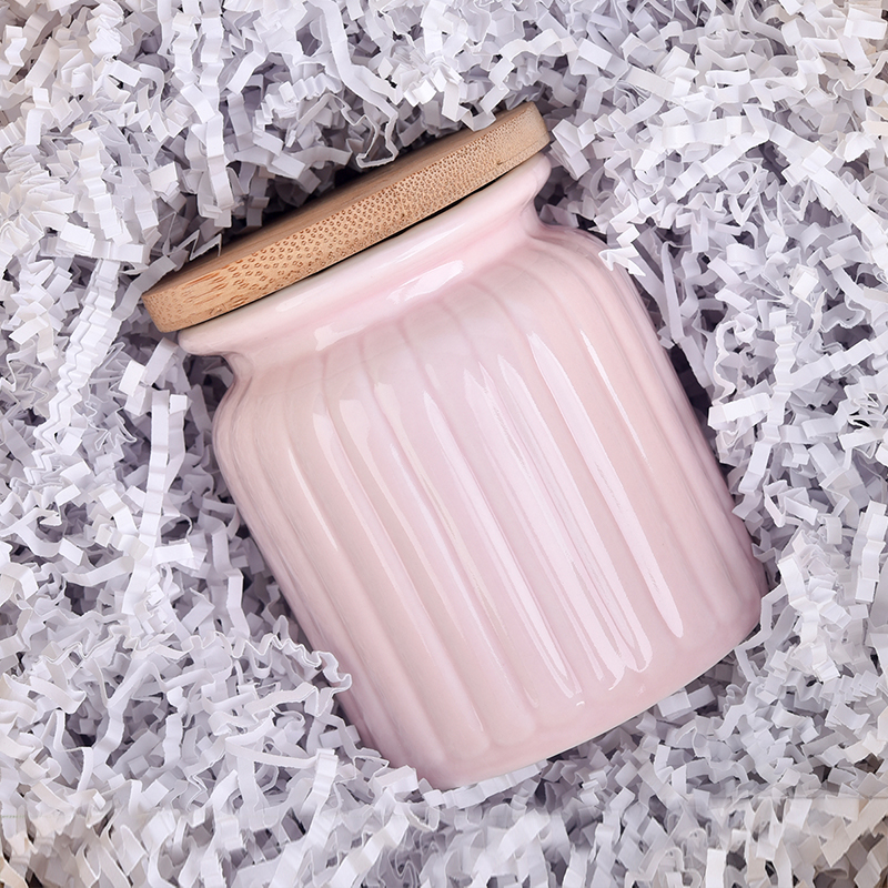 Pink ceramic jar with stripe pattern 