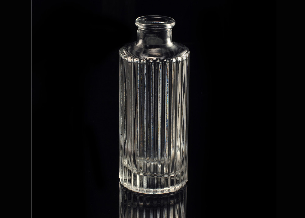 Embossed stripe clear glass perfume bottle