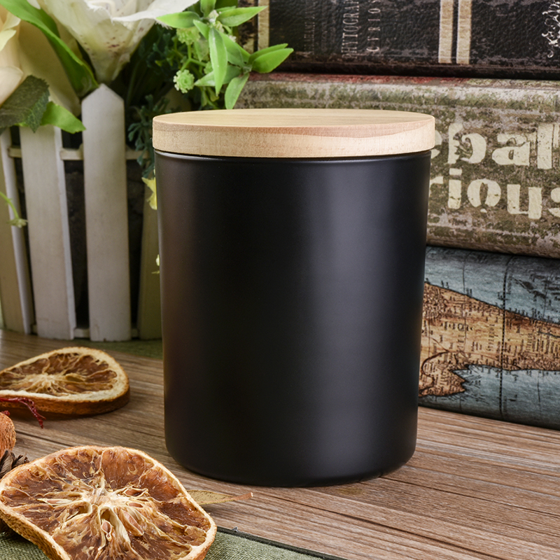 Black cylinder glass vessel for candles with wood lid