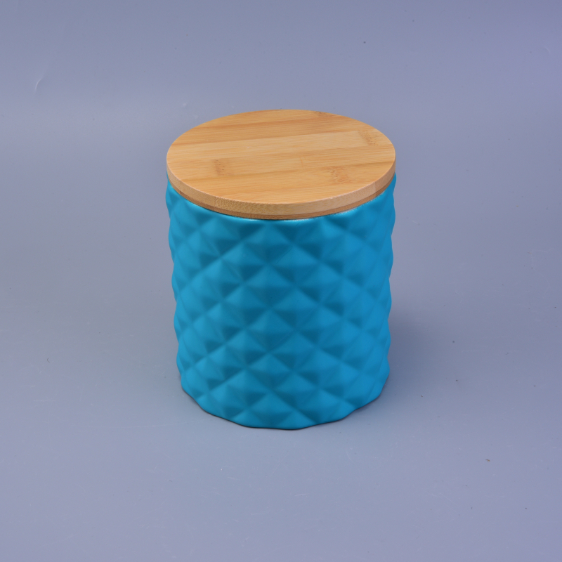 blue ceramic candle holder with diamond-shaped pattern surface