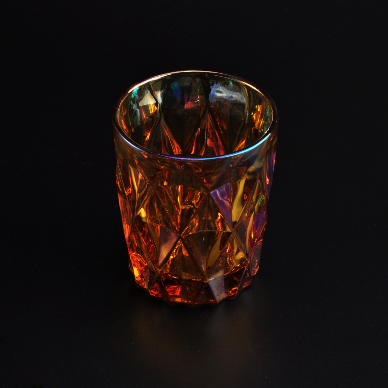 Iridescent glass candle holder with diamond-shaped pattern surface
Iridescent glass candle holder with diamond-shaped pattern surface