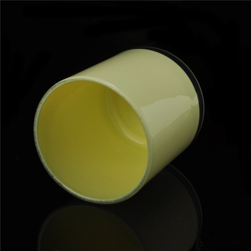 Yellow painted cylindrical glass vessel for candles
Yellow painted cylindrical glass vessel for candles