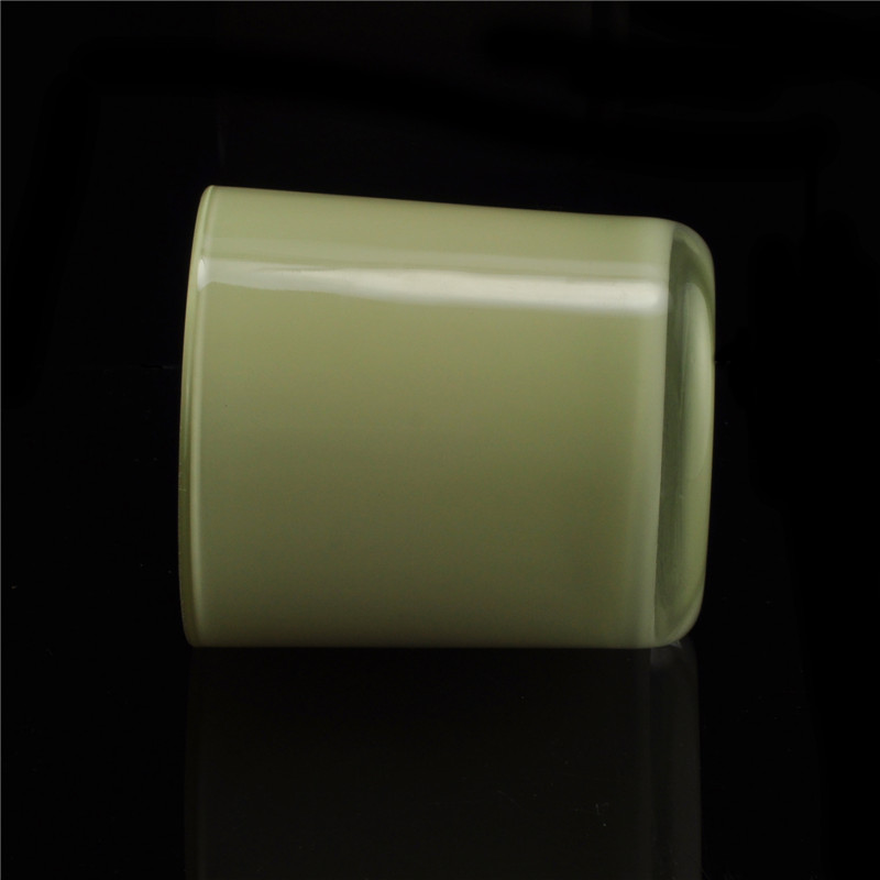 Yellow painted cylindrical glass vessel for candles
Yellow painted cylindrical glass vessel for candles