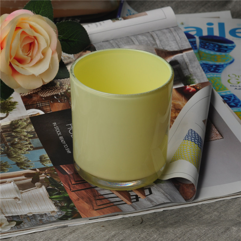 Yellow painted cylindrical glass vessel for candles Yellow painted cylindrical glass vessel for candles