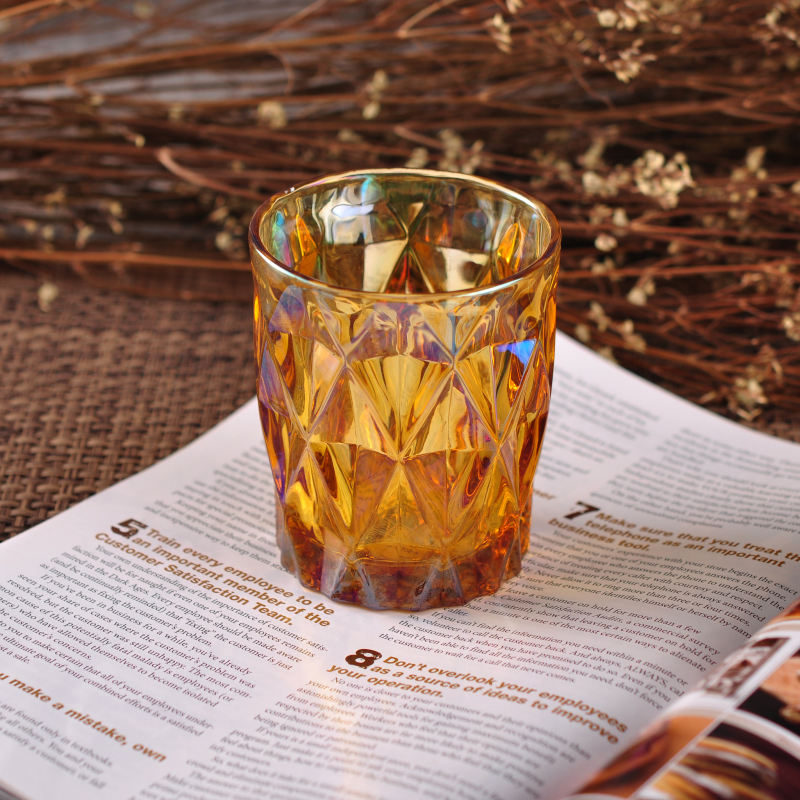 Iridescent glass candle holder with diamond-shaped pattern surface Iridescent glass candle holder with diamond-shaped pattern surface