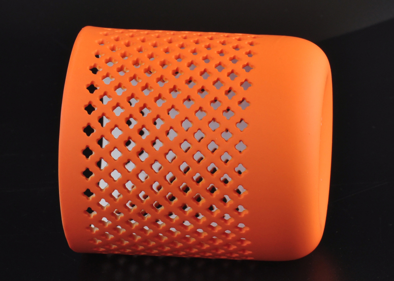 Orange sprayed grid hollow ceramic candle holder