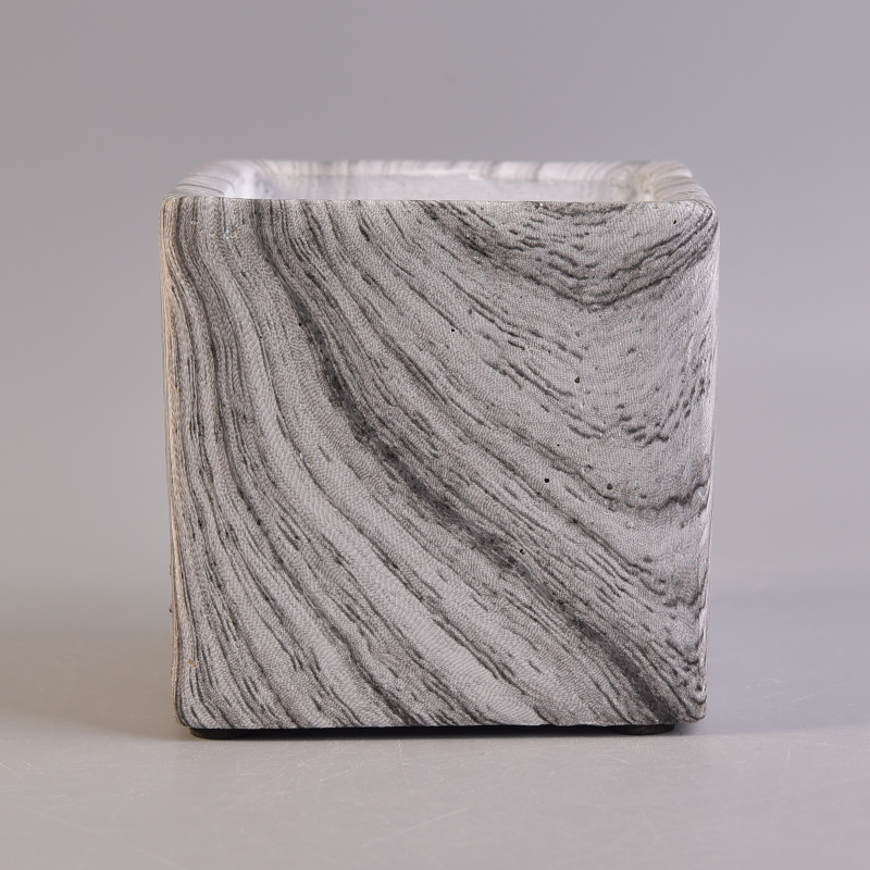 White square concrete candle holder with brown stripes pattern