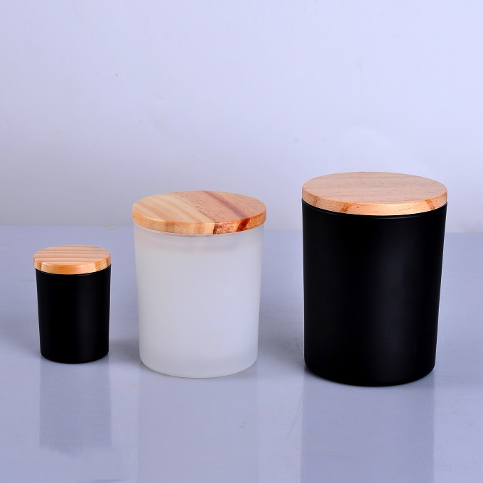 matte black and matte white candle jars with wooden lid