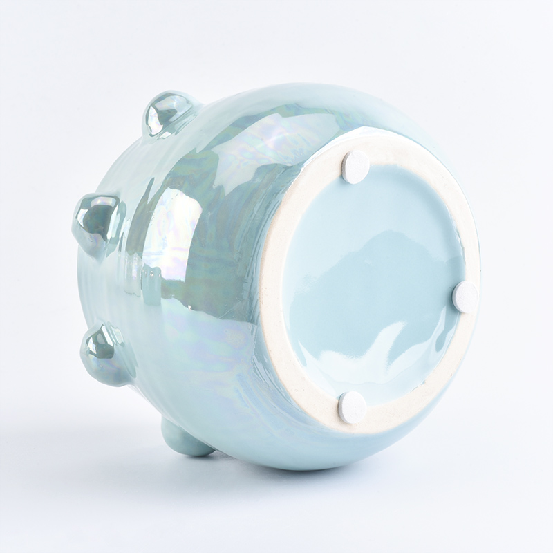 Blue ceramic candle jar with iridescent effect glaze finish 