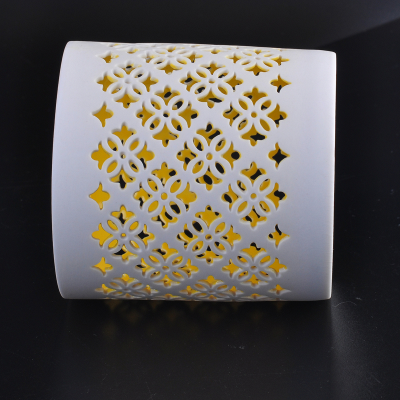 White hollow-out ceramic candle holder vessel flower pattern yellow inner
White hollow-out ceramic candle holder vessel flower pattern yellow inner