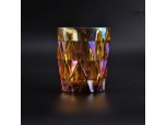 Iridescent glass candle holder with diamond-shaped pattern surface