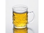 clear glass beer mug with embossed pattern