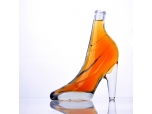 botella de vino de cristal con forma de zapato de tacón