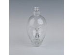 transparent face shaped glass wine bottle